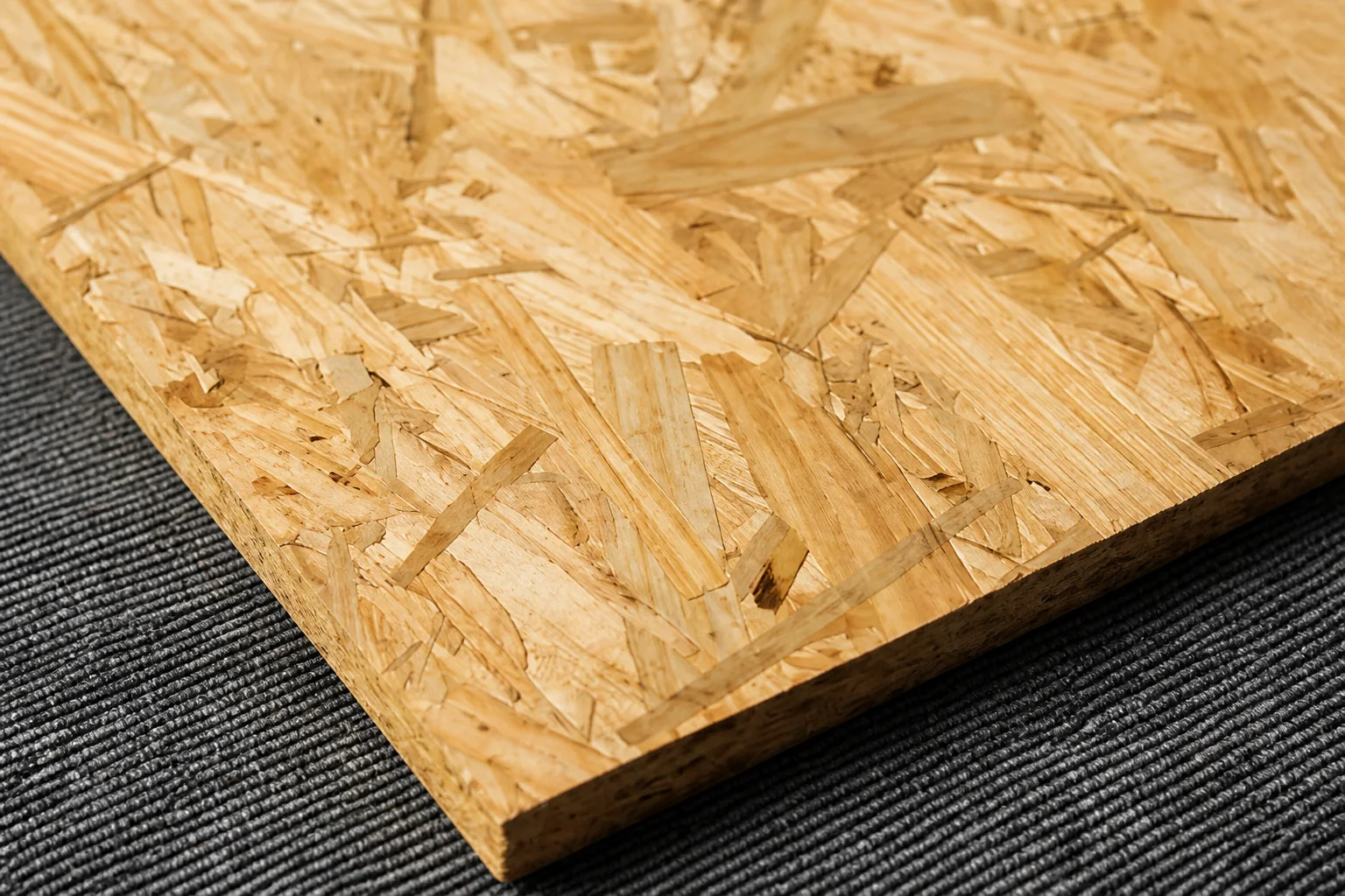 OSB panel showing oriented wood strands and a cut edge