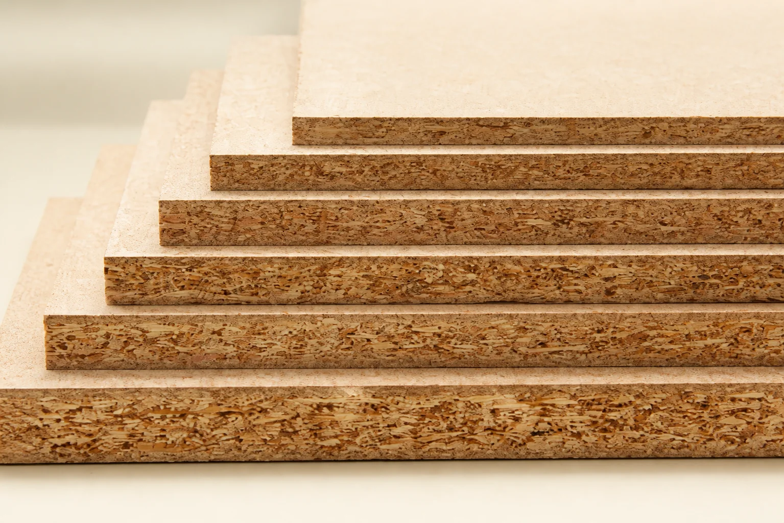 Particleboard cabinet panels showing compressed wood particles