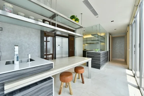 Wood-finish kitchen cabinetry in a Singapore residential project