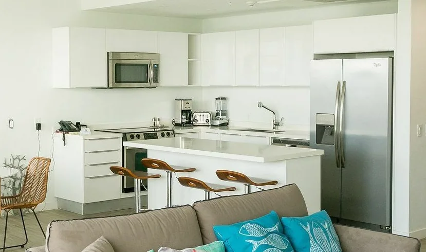 White kitchen cabinetry in an Aruba beachfront apartment