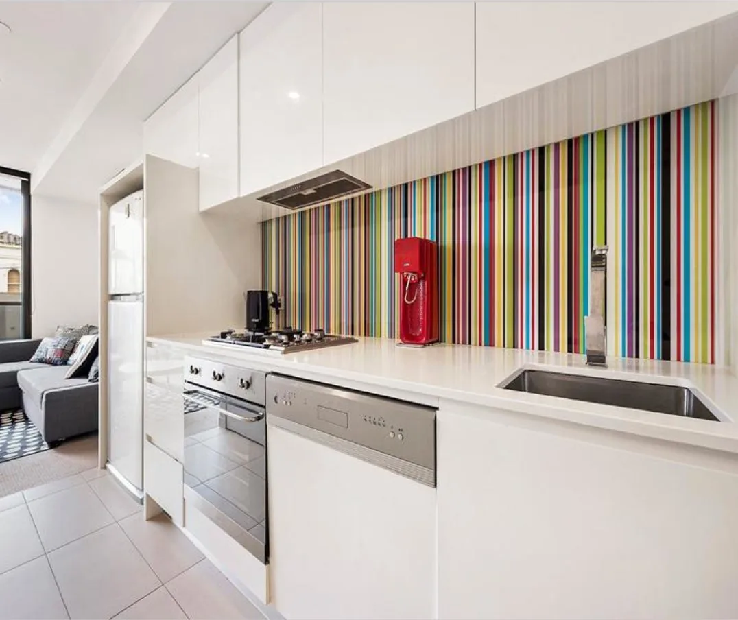 Contemporary white kitchen cabinetry in a Melbourne apartment