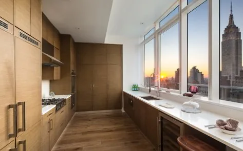 Timber-finish kitchen cabinetry in a New York apartment