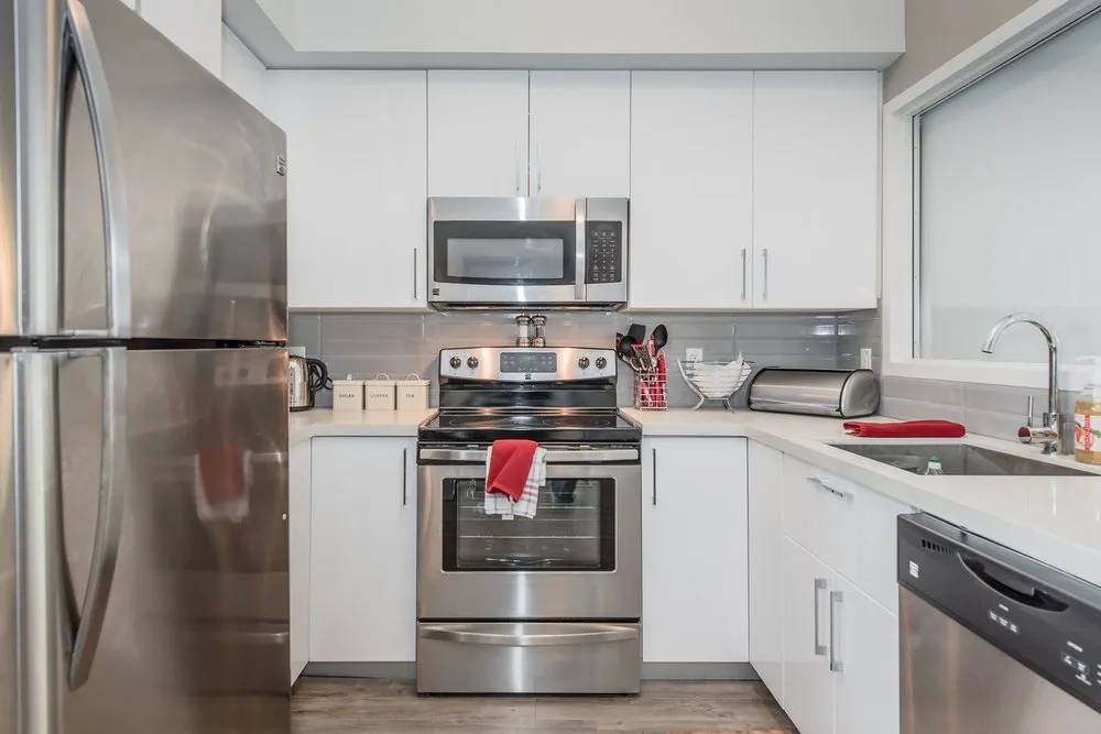 White lacquer kitchen cabinetry in a Waterloo apartment