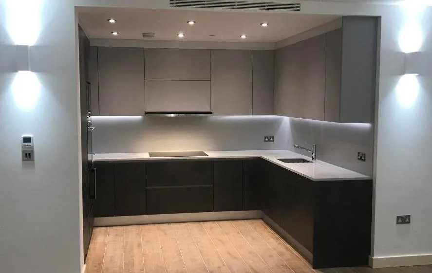 Dark kitchen cabinetry in a converted London residential building