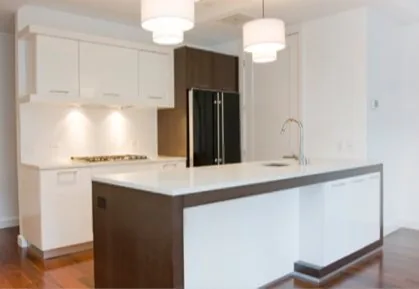 Two-tone kitchen cabinetry in a Brooklyn apartment