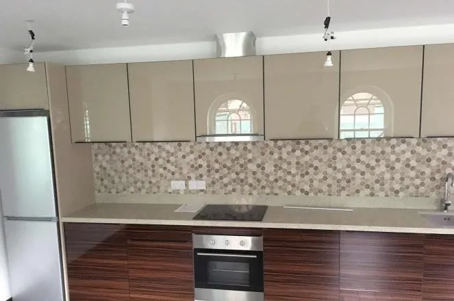 Kitchen cabinetry with glass doors in a London residence
