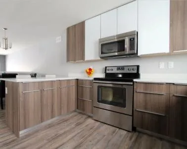 Wood-tone kitchen cabinetry in a Saskatoon low-rise residence