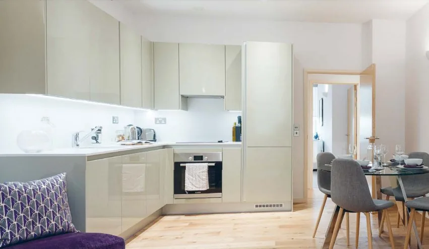 Compact white kitchen cabinetry in a North London residence