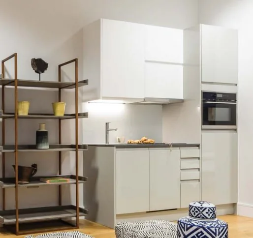 Light lacquer kitchen cabinetry in an English apartment