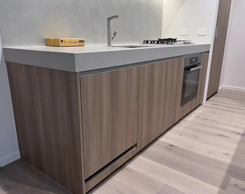 Timber-finish vanity cabinetry in a Melbourne apartment
