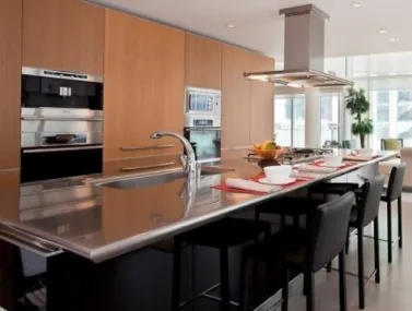 Timber-veneer kitchen cabinetry in a Vancouver residence