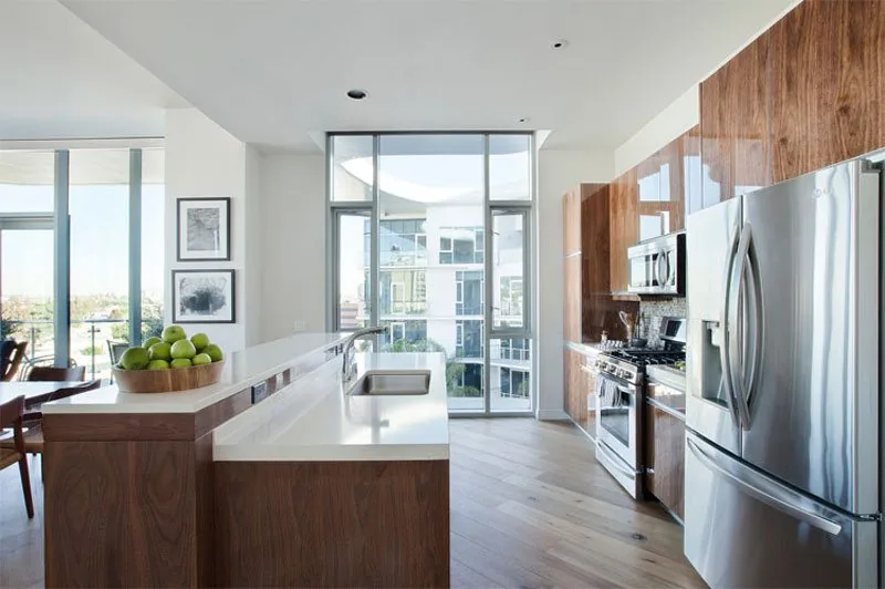 High-gloss timber-veneer kitchen in a Los Angeles apartment