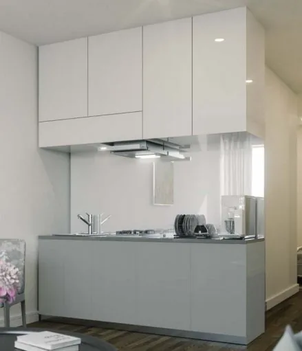 Grey and white lacquer kitchen in an English office conversion